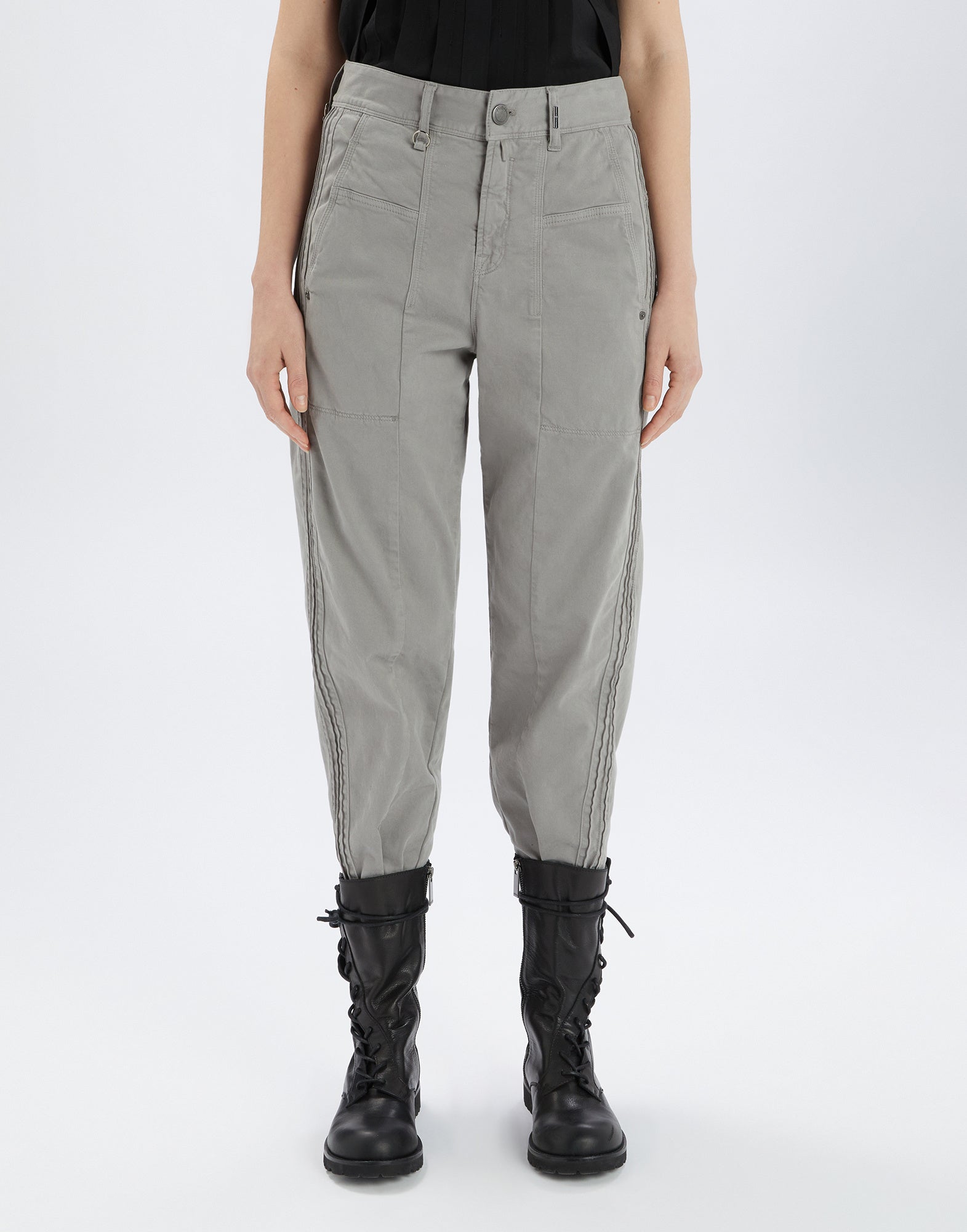 Front view of the grey ACTIVATE pants featuring visible seams, fly, belt loops, and patch side pockets, worn with black boots.